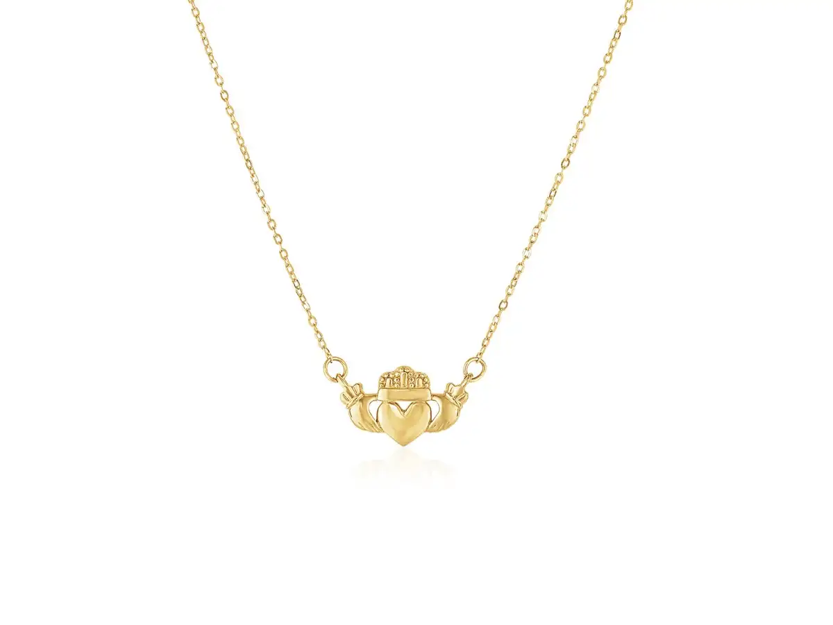 This simple gold pendant features a Claddagh symbol, a traditional Irish symbol of love and friendship.