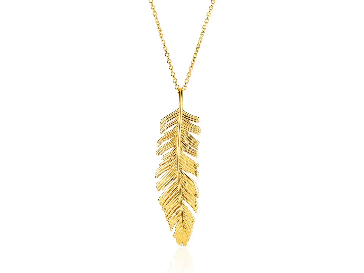 A simple textured gold feather adorns a fine gold chain.